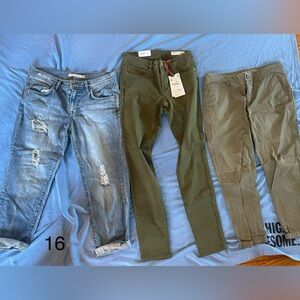All three pairs of jeans, skinny green denim and green chinos